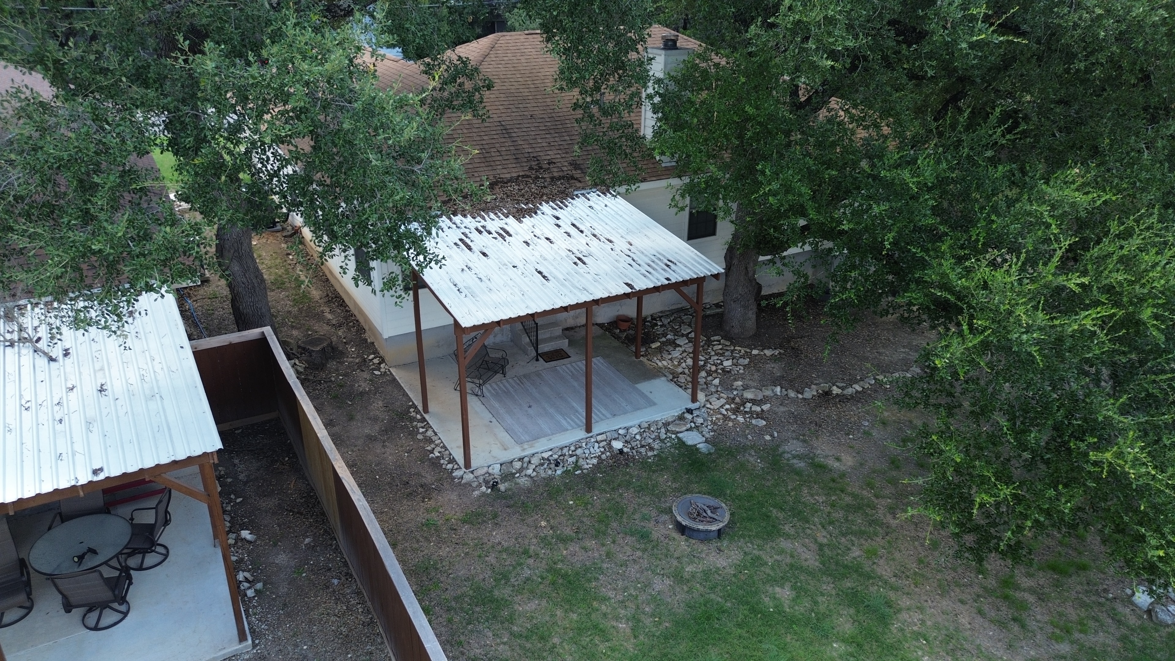 Backyard patio with metal roof structures