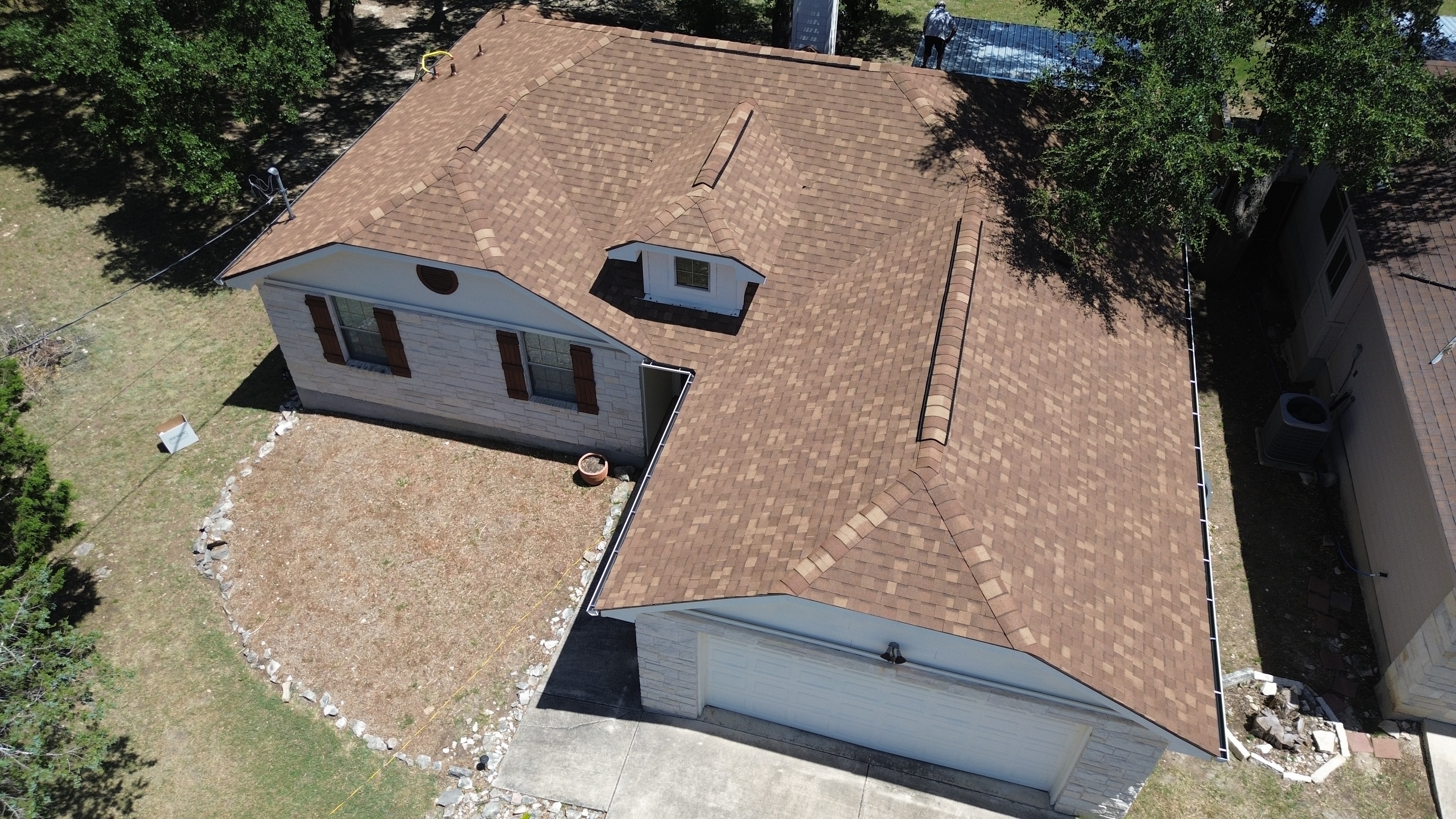 Aerial view completed roof with garage