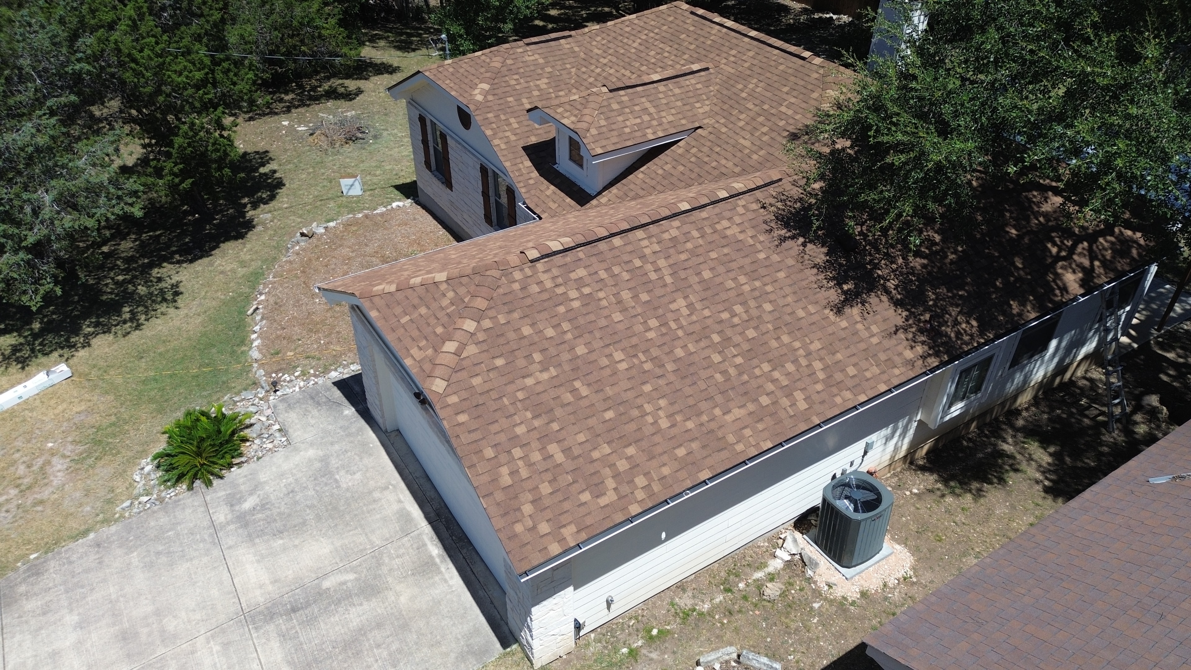 Aerial view completed roof with AC unit