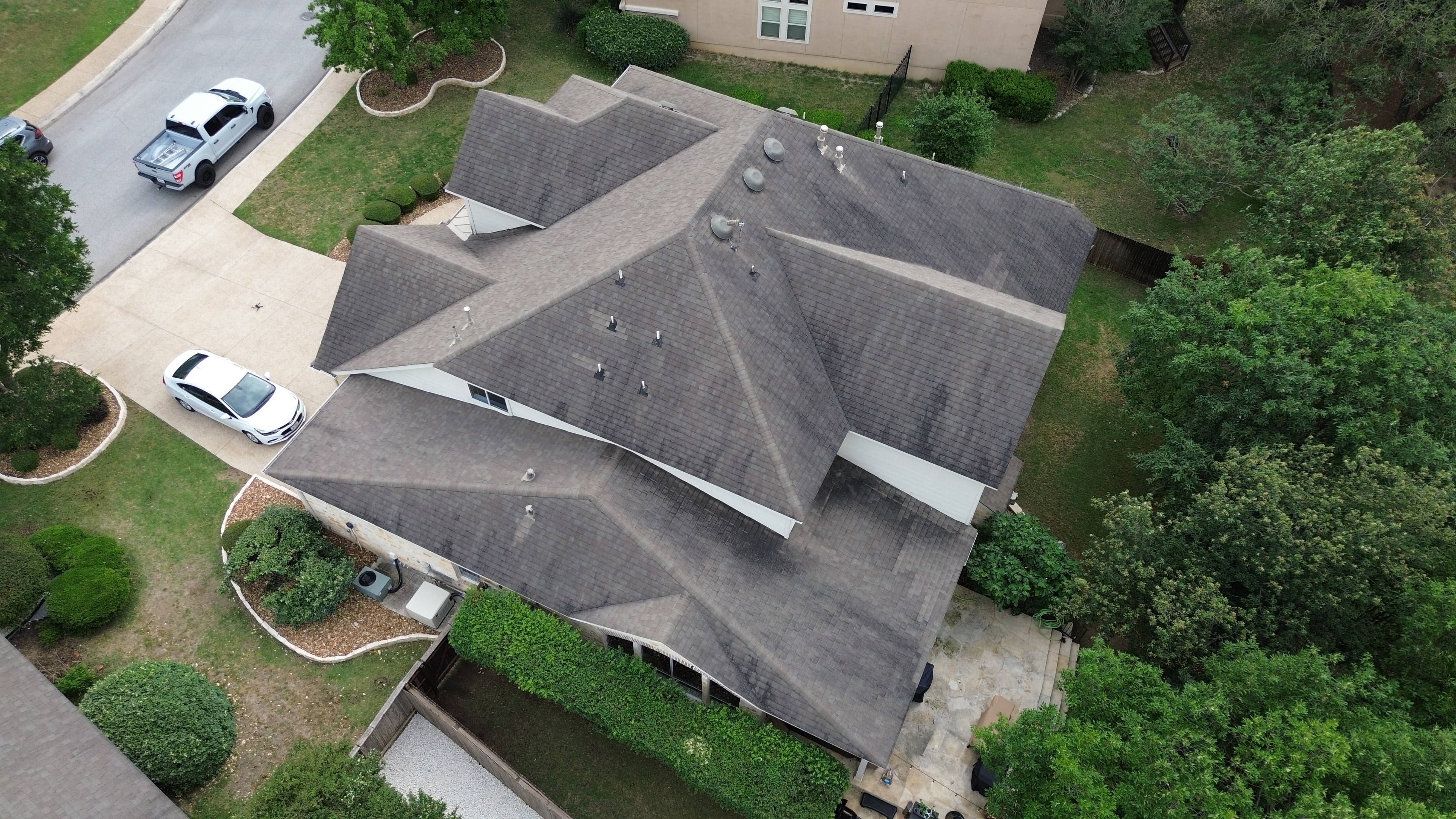 Aerial view suburban home with driveway